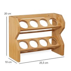 a wooden shelf with holes on it and measurements for the bottom half of each shelf