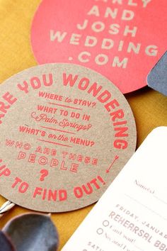 wedding stationery and tags are laid out for guests to use on their menus