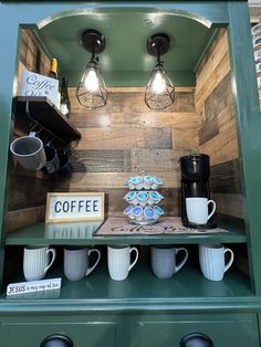 coffee cups are sitting on top of a shelf