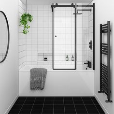 a black and white tiled bathroom with a plant in the corner, mirror on the wall