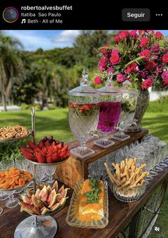 a table topped with lots of different types of foods and desserts on top of it