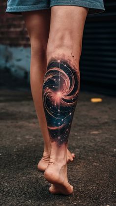 a woman's leg with a tattoo on it and an image of a star in the sky