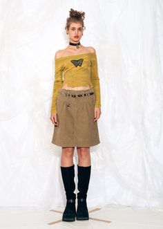 Introducing the Y2K vintage midi skirt - it's like experiencing the (not so) fabulous fashion era all over again. Slip into this beige microcord beauty and relive the days of regrettable hairstyles and avocado-shaped cellphones. Features: - two pockets - zip closure - 98% cotton, 2% elastane Every item we manage is cleaned and, when necessary, repaired, ensuring it arrives to you in top condition. Our model, Kisa is 180 cm / 70.2" tall and she's a size M. Size: M / US 6 / UK 10 / IT 42 Other siz Y2k Cotton Mini Skirt For Fall, Y2k Style Fitted Brown Skirt, Y2k Style Brown Skirt For Spring, Y2k Brown Skirt For Spring, Brown Fitted Y2k Skirt, Brown Y2k Skirt For Spring, Y2k Style Winter Mini Skirt, Y2k Style Mini Skirt For Fall, Y2k Mini Skirt For Fall