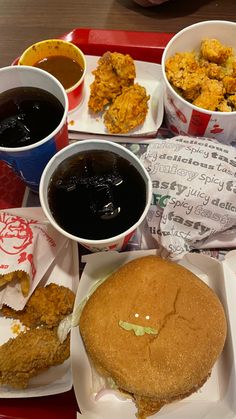 a tray filled with lots of different types of food on top of paper napkins