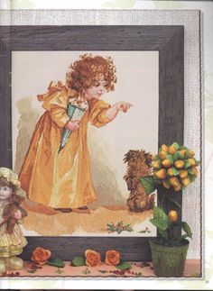 a cross - stitch picture of an angel and two teddy bears in front of a flower pot