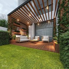 an outdoor living area with wooden slats and white couches on the grass, surrounded by greenery