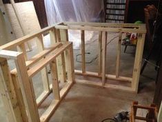 the unfinished room is being built and ready to be used as a storage area for bookshelves