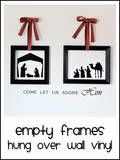 two framed pictures with the words, empty frames hung over wall in black and white