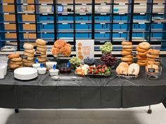 a table covered with lots of different types of food and desserts on it's sides