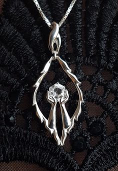 The elder scrolls ,unique designed Meridia bacon pendant inspired by skyrim lore made in silver 925 and set with natural white topaz its an unusuall approach on jewelry inspired by TES5  lore. The pendant can be casted also in yellow, rose and white gold  14k. the pendant can be set with different  stones  and different shapes  hexagons,pear shapes, ovals ,round stones..  can be set with stones like,morganite,rosecut diamond G si1 ,sapphire,topaz.. Elegant Silver Jewelry For Fantasy Events, Hand Cast Fantasy Sterling Silver Jewelry, Fantasy Pendant Jewelry For Fantasy Events, Silver Pendant Jewelry For Fantasy Events, Elvish Style Jewelry Gift, Silver Fantasy Necklace With Hand Cast, Fantasy Sterling Silver Pendant Jewelry, Silver Engraved Jewelry For Costume Events, Silver Gothic Jewelry For Costume