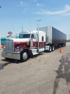 a large semi truck parked in a parking lot