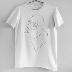 Minimalist Feminine Face Line Art Tee Brand New! Our In House T-Shirts Are High Quality And Printed On Demand. This Tee Features A Minimalist Black On White Design, 100% Cotton, Relaxed Boyfriend Fit, And Gorgeous Minimal Black And White Relaxed Female/Woman Profile. Size S-Xl Available (Model Is Wearing A Size M) Woman Profile, Lake Life Shirt, Feminine Face, Face Line Art, Lululemon Shirt, Striped Linen Shirt, Southern Ladies, Face Lines, Female Profile