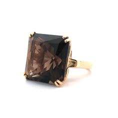 Late 20th Century Estate 14kt yellow gold basket style ring featuring a 4-split prong set smoky quartz.  The cathedral shoulder ring is finished with a bright polish.  Gemstone: 1 square mixed cut smoky quartz, 24.30 carat weight (calculated in mounting) medium-dark tone brown color Dimensions: 19mm W top x 13.2mm tall center x 2.8mm W ring base Ring size: 6.25 Weight: 14.2 grams Condition: Excellent wearable condition Brown Ring, Gold Basket, Brown Rings, Twisted Bangle, Basket Style, Smoky Quartz Ring, Brown Stone, Gem Ring, Woven Bracelets