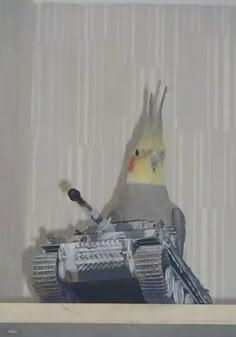 a bird is perched on top of a tank