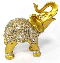 an elephant made out of gold and diamonds