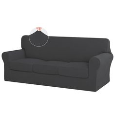 a black couch with a white patch on it