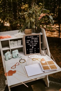 a table with some items on it and a chalkboard in the middle that says i love you