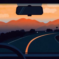 a car driving down a road with mountains in the background at sunset or sunrise time