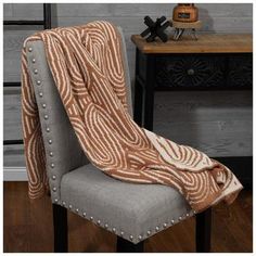 a chair with a blanket on top of it