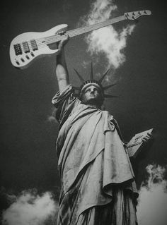 the statue of liberty is holding an electric guitar