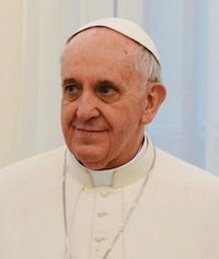 a man in a priest's outfit standing next to a window