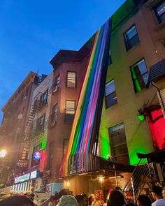 Streamers in the color of a rainbow pride flag lay over the entrance of a bar in new york city at night Queer Travel, New York Pride, Nyc Pride Parade, Podcast Branding, Ian Gallagher, 2024 Board, Gay Pride Parade, Gay Rights, Pony Club