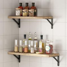 two wooden shelves with spices and condiments on them in a white tiled bathroom