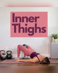 a woman is doing yoga in front of a wall with the words inner thighs on it