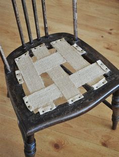 an old chair with some fabric squares on it