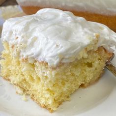 a close up of a piece of cake on a plate with a fork in it