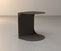 a black table sitting on top of a white floor