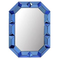 a mirror with blue glass cubes on it's sides and a white background