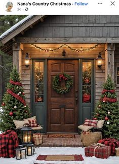 the front door is decorated for christmas with wreaths and lights on it, along with presents