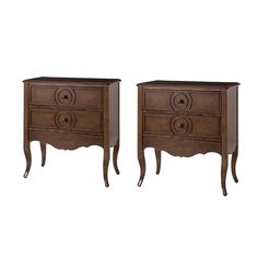 two wooden nightstands sitting next to each other