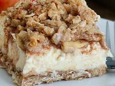 a piece of dessert sitting on top of a white plate with a fork next to it