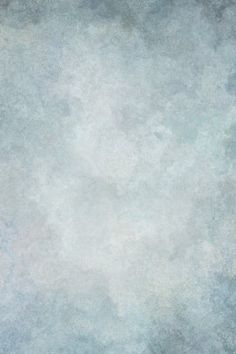 an abstract background with white and blue colors in the middle, including some small clouds