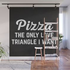 a black and white wall mural with the words pizza, the only love triangle i want