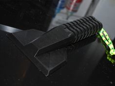 a green and black object sitting on top of a table