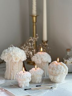 some candles are sitting on a table