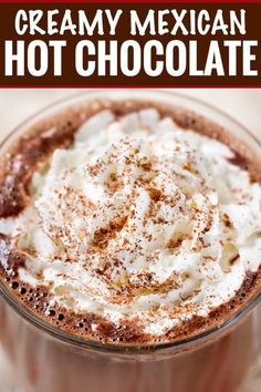 a close up of a hot chocolate drink with whipped cream on top and the words creamy mexican hot chocolate above it