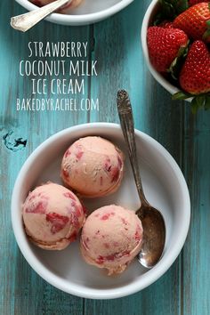 three scoops of strawberry coconut milk ice cream in a bowl next to strawberries