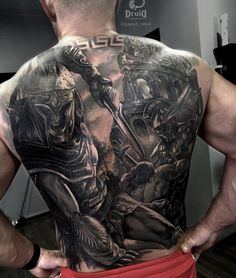 a man with tattoos on his back