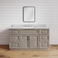 a bathroom vanity with two sinks and a mirror on the wall above it, in front of a white shipboard wall