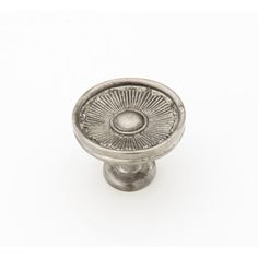 an antique style door knob on a white background