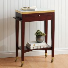 a small table with a potted plant on top