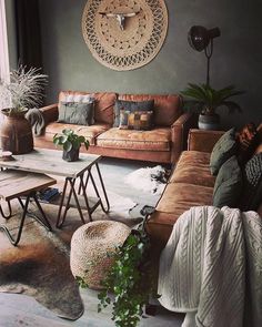 a living room filled with lots of furniture next to a wall mounted sun dial clock