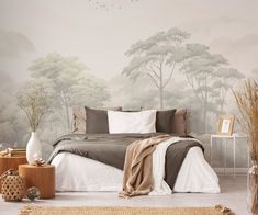 a bedroom with a large bed and wall mural