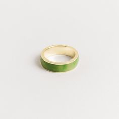 Introducing our 7mm men's inlay band, crafted with the finest green jade. This exquisite ring is a testament to the natural beauty of the stone and the stunning shades of green that jade is known for. We take great pride in sourcing our jade directly from the family that mines it, ensuring that every piece is of the highest quality and ethically sourced. The green jade is expertly cut and polished, then set into the band with precision and care. Our 7mm width is our most popular option, providin Jade Wedding Rings For Men, Modern Green Ring For Promise, Modern Green Promise Ring, Formal Green Enamel Ring With Polished Finish, Green Enamel Ring With Polished Finish As Gift, Silver Jade Ring, Modern Green Emerald Ring With Polished Finish, Minimalist Green Emerald Ring With Polished Finish, Green Enamel Ring With Polished Finish For Anniversary