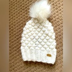 Never Worn Hat. Super Cut Knit Design With Faux Fur Pom. Cozy White Knit Hat, White Crochet Knit Hat For Winter, Cozy White Crochet Hat For Fall, Cozy White Crochet Hat For Cold Weather, White One-size Bonnet For Cold Weather, White One Size Bonnet For Cold Weather, One Size White Bonnet For Cold Weather, White Crochet Beanie Hat For Fall, White Knit Beanie Bonnet