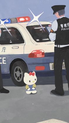 two police officers standing in front of a hello kitty toy next to a cop car